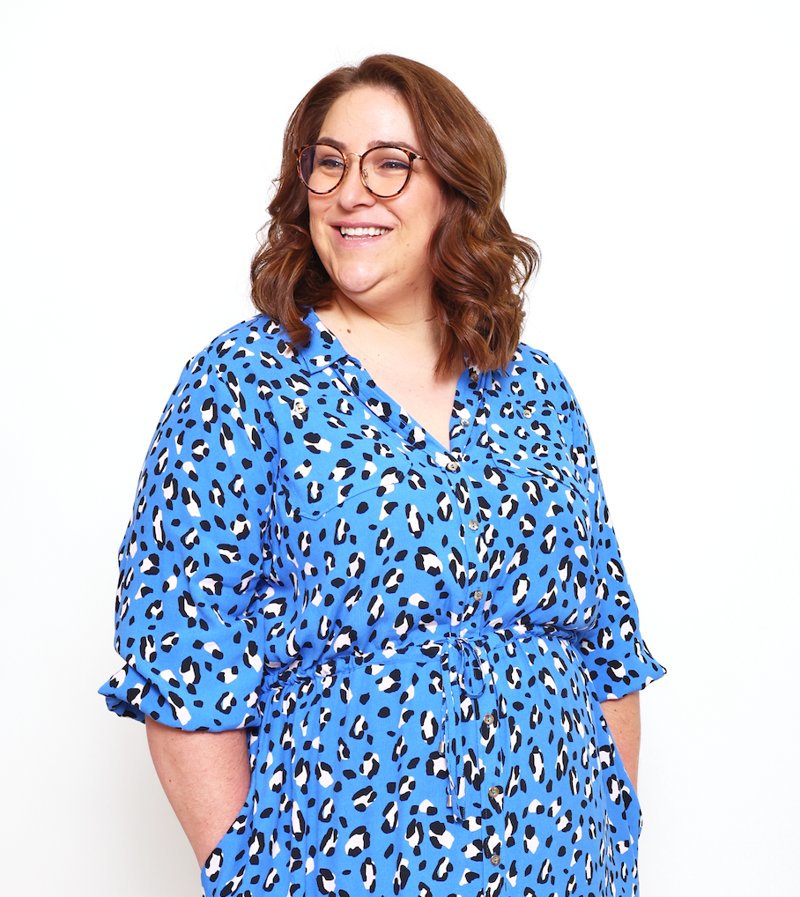 Laura, founder of Part Time on Purpose, smiling in a blue patterned dress